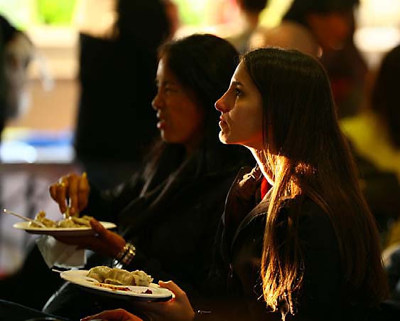 Eating Tibetan momos and enjoying the cultural performances